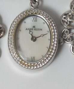 Anne Klein Women’s Stainless Steel Charm Bracelet Watch close up face