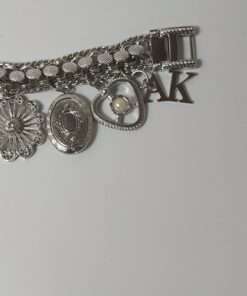 Anne Klein Women’s Stainless Steel Charm Bracelet Watch close up charm view