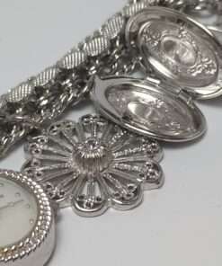 Anne Klein Women’s Stainless Steel Charm Bracelet Watch close up locket open
