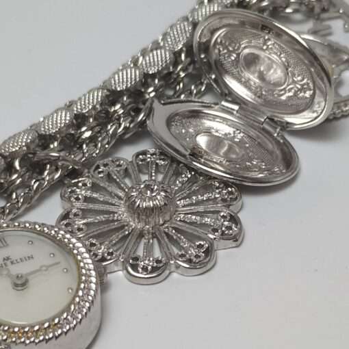 Anne Klein Women’s Stainless Steel Charm Bracelet Watch close up locket open