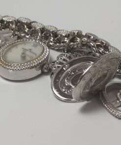 Anne Klein Women’s Stainless Steel Charm Bracelet Watch close up locket