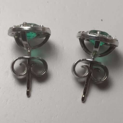 Emerald and Diamond Halo Stud White gold Earrings close up